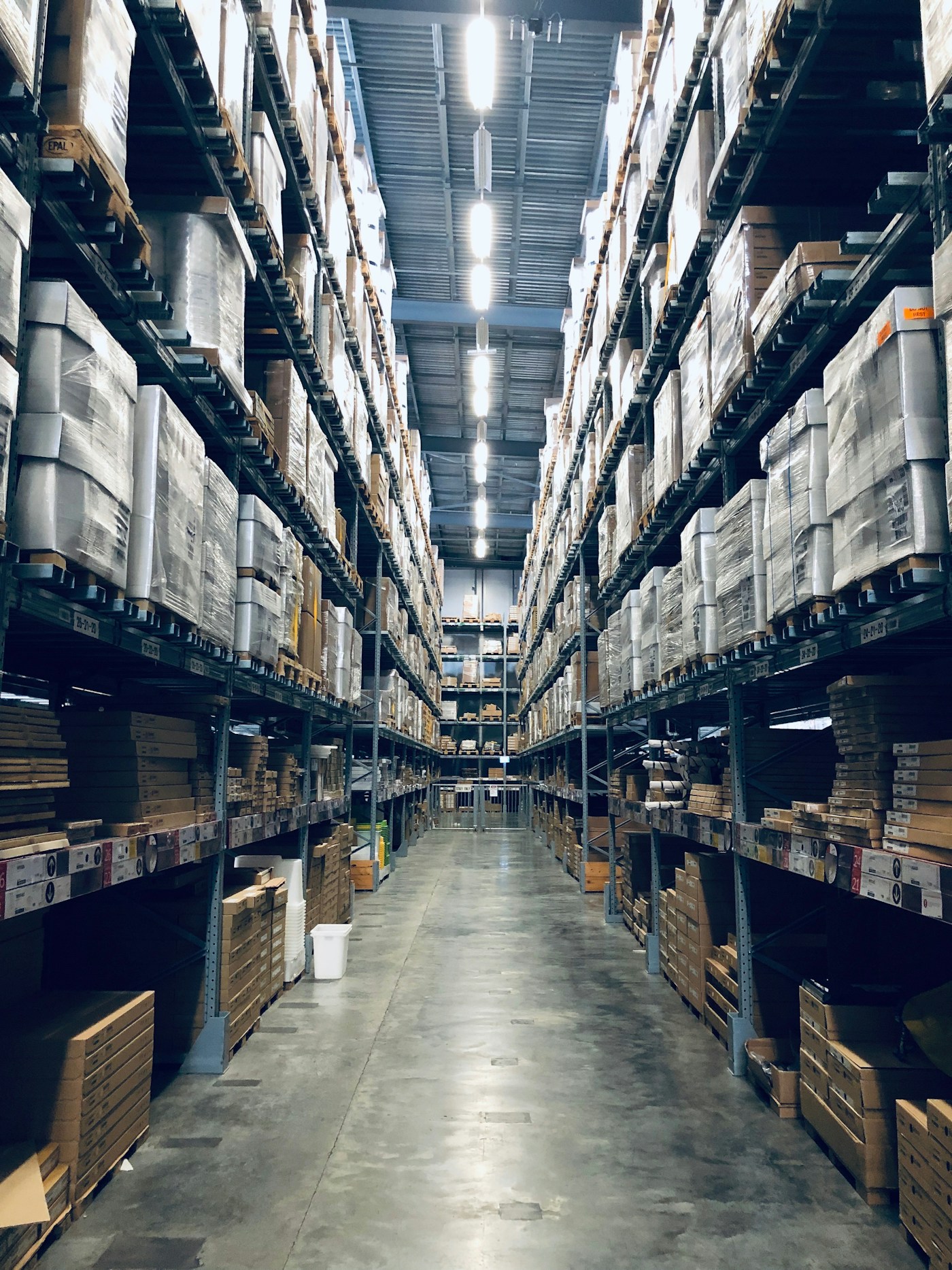 Shelves of organised goods in a warehouse